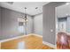 Charming dining room featuring hardwood floors, a modern chandelier, and views of the entry at 1900 Garvin St, Orlando, FL 32803