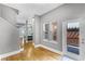 Inviting entryway featuring hardwood floors, neutral paint, and a clear view into the adjacent kitchen space at 1900 Garvin St, Orlando, FL 32803
