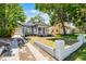Charming home with inviting front porch, manicured lawn, and walkway leading to the entrance at 1900 Garvin St, Orlando, FL 32803