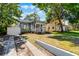 Charming home with inviting front porch, manicured lawn, and walkway leading to the entrance at 1900 Garvin St, Orlando, FL 32803