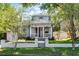Charming two-story home with a cozy front porch and well-manicured lawn at 1900 Garvin St, Orlando, FL 32803