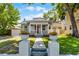 Charming home with inviting front porch, manicured lawn, and walkway leading to the entrance at 1900 Garvin St, Orlando, FL 32803