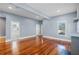 Spacious living room featuring hardwood floors and an open floor plan to the bathroom at 1900 Garvin St, Orlando, FL 32803