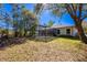 Picturesque backyard with screened pool, mature trees, and fencing at 20773 Starry St, Orlando, FL 32833