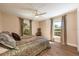 Cozy bedroom featuring a comfortable queen-sized bed, wood-look floors, and two bright windows at 20773 Starry St, Orlando, FL 32833