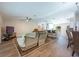 Open living space with wood floors, and bar seating adjacent to kitchen at 20773 Starry St, Orlando, FL 32833