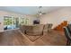 Spacious living room with wood floors and sliding glass doors to the pool at 20773 Starry St, Orlando, FL 32833