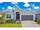Charming single-Gathering home with a two-car garage, manicured lawn and beautiful landscaping at 2348 Victoria Dr, Davenport, FL 33837