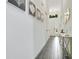 Bright hallway featuring tile floors, neutral walls, and elegant decor elements at 2348 Victoria Dr, Davenport, FL 33837