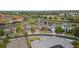 Aerial view of the neighborhood showcasing the proximity to the pond and golf course at 2371 Victoria Dr, Davenport, FL 33837