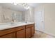 Bathroom features a dual sink vanity with wood cabinets and a shower and bath combo at 2371 Victoria Dr, Davenport, FL 33837