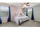 Comfortable bedroom with canopy, complemented by stylish decor and abundant natural light at 2371 Victoria Dr, Davenport, FL 33837
