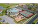 Aerial view of the community amenities including pool, clubhouse, playground and tennis courts at 2371 Victoria Dr, Davenport, FL 33837