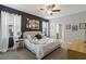 Stylized bedroom with a large bed, dark accent wall, and themed decor at 2371 Victoria Dr, Davenport, FL 33837