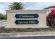 Community sign for Clubhouse and Fairway Villas featuring well maintained landscaping at 2371 Victoria Dr, Davenport, FL 33837