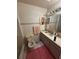 Bathroom with tile flooring and walls, vanity with sink, commode, and bathtub at 250 Raintree Dr, Casselberry, FL 32707