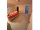 Bedroom features tile flooring, window, and en-suite bathroom at 250 Raintree Dr, Casselberry, FL 32707