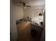 Simple bedroom with fan, tile floors, large desk, and natural light from window at 250 Raintree Dr, Casselberry, FL 32707