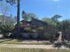 Charming home featuring mature landscaping and a cozy front porch at 250 Raintree Dr, Casselberry, FL 32707