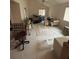 View of the spacious living room featuring a tiled floor and natural light from the windows at 250 Raintree Dr, Casselberry, FL 32707