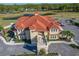 Aerial view showcasing the building's architecture, landscaping, and proximity to parking at 2724 Sarzana Ln, Apopka, FL 32712