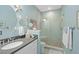 Clean, spacious bathroom with glass-enclosed shower, tile accents, and modern fixtures at 2724 Sarzana Ln, Apopka, FL 32712