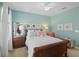 Comfortable bedroom features beautiful decor, stylish furnishings, and a ceiling fan at 2724 Sarzana Ln, Apopka, FL 32712