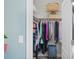 Spacious walk-in closet with plenty of storage and a full hanging rack at 2724 Sarzana Ln, Apopka, FL 32712