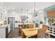 Bright kitchen features white cabinetry, stainless steel appliances, and a large central island at 2724 Sarzana Ln, Apopka, FL 32712