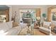 Inviting living room with stylish furniture and view of the screened patio and pool at 2724 Sarzana Ln, Apopka, FL 32712