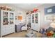 Inviting office with ample display shelving, a lilac desk and a sofa bed at 2724 Sarzana Ln, Apopka, FL 32712