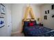 Intriguing bedroom with canopy, featuring unique décor and furnishings at 2735 San Marco Way, Winter Haven, FL 33884
