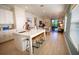 Bright, open kitchen flows into dining area, featuring stainless steel appliances and a large island at 2735 San Marco Way, Winter Haven, FL 33884