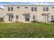 Spacious backyard with lush green grass and sliding glass doors, ideal for outdoor relaxation at 2788 Pierr St, Davenport, FL 33837