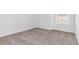 A bedroom with neutral carpet and a window at 2788 Pierr St, Davenport, FL 33837