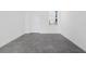 An empty living room with tile floors, a front door, and a window at 2788 Pierr St, Davenport, FL 33837