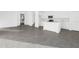 Open-concept living space featuring modern gray tile floors and a bright, inviting atmosphere at 2788 Pierr St, Davenport, FL 33837