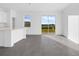 Bright living area featuring a sliding glass door to the backyard and a modern tile floor at 2788 Pierr St, Davenport, FL 33837