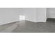 A minimal room with gray tile floors and a door at 2788 Pierr St, Davenport, FL 33837