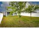 Fenced backyard with landscaping at 3010 Ballad Rd, Kissimmee, FL 34746
