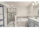 Modern bathroom featuring a glass-enclosed shower and a luxurious soaking tub at 3010 Ballad Rd, Kissimmee, FL 34746