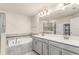 Stylish bathroom featuring double sinks, a soaking tub, and a separate glass-enclosed shower at 3010 Ballad Rd, Kissimmee, FL 34746