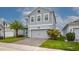 Charming two-story home with a brick paver driveway and well-maintained landscaping at 3010 Ballad Rd, Kissimmee, FL 34746