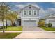 Charming two-story home with a brick paver driveway and well-maintained landscaping at 3010 Ballad Rd, Kissimmee, FL 34746