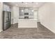 Modern kitchen with an island and stainless steel appliances at 3010 Ballad Rd, Kissimmee, FL 34746