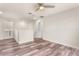 Spacious loft area with wood floors, a ceiling fan, and doorways to other rooms at 3010 Ballad Rd, Kissimmee, FL 34746