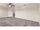 Spacious main bedroom with plush carpeting and access to the ensuite bathroom at 3010 Ballad Rd, Kissimmee, FL 34746