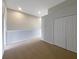 Bedroom featuring neutral walls, carpet, and closet at 3020 Alessa Loop, Apopka, FL 32703