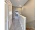 Hallway leading to stairs with carpet at 3020 Alessa Loop, Apopka, FL 32703