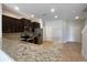 Modern kitchen featuring granite countertops and stainless steel appliances at 3020 Alessa Loop, Apopka, FL 32703